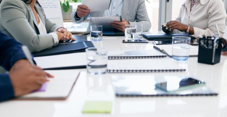 Hands, documents and hands of business people in office meeting for financial, review or budget analysis
